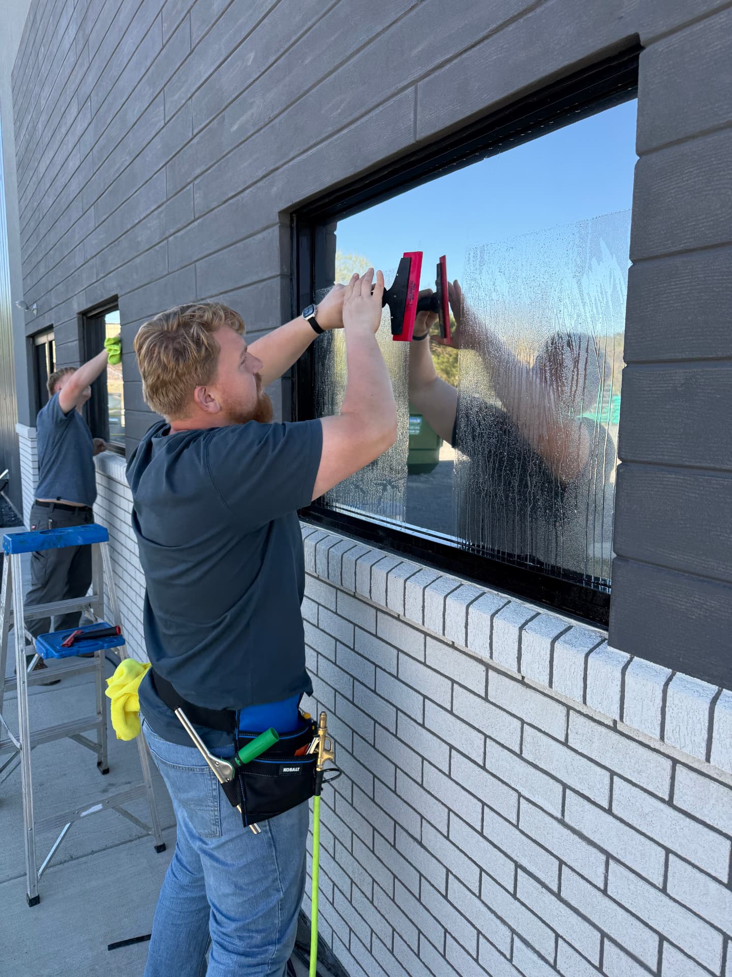 Window film installation on exterior commercial glass